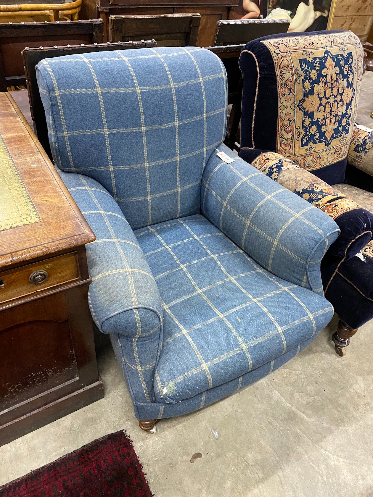 A Victorian upholstered armchair, width 83cm, depth 92cm, height 90cm